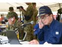 知事が電話している